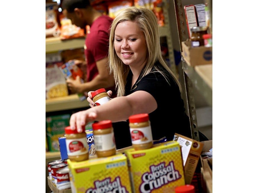 Stocking shelves in the food pantry	